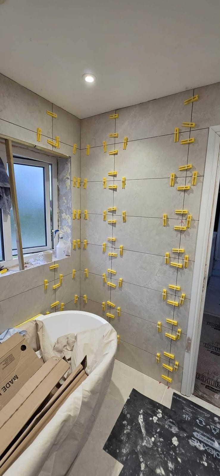 Bathroom tiling in progress